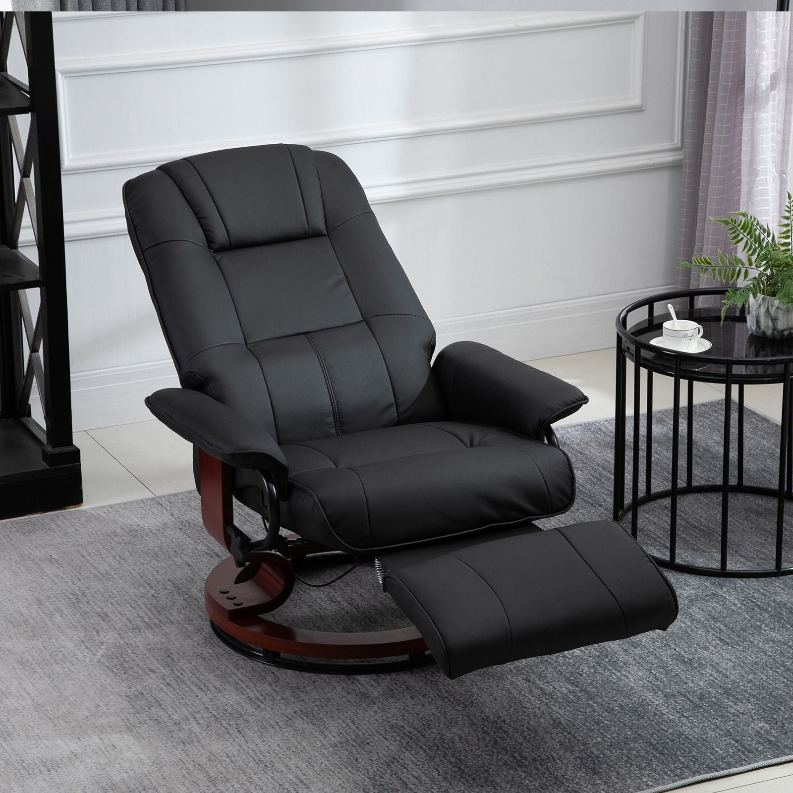 Living Room Relaxation: Black Faux Leather Swivel Recliner with Adjustable Footrest